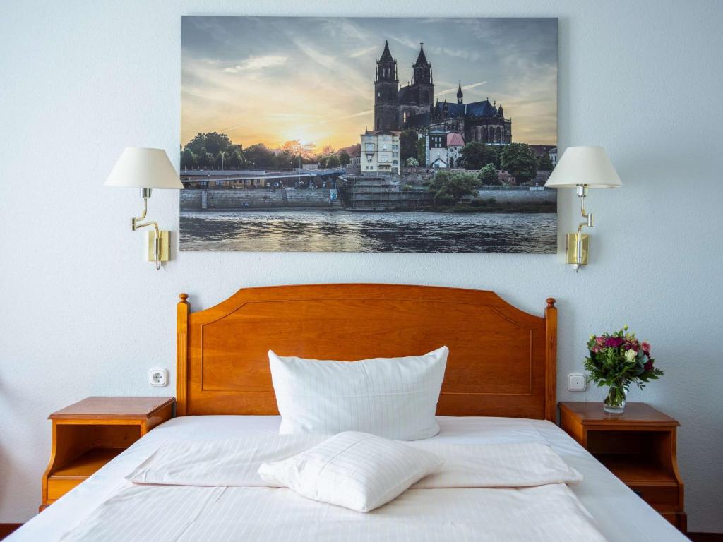 Postel nebo postele na pokoji v ubytování Mercure Hotel Plaza Magdeburg