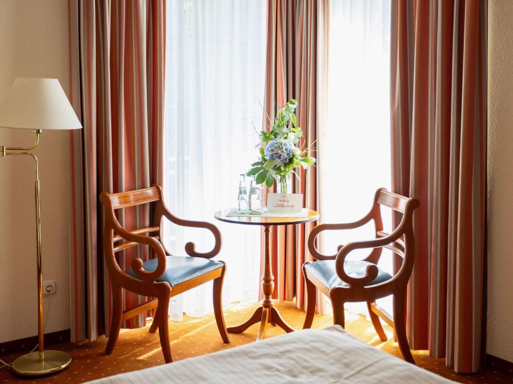 Postel nebo postele na pokoji v ubytování Mercure Hotel Plaza Magdeburg