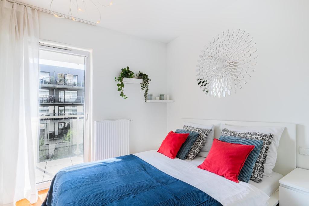 Postel nebo postele na pokoji v ubytování Apartamenty Homely Place Casa Verona - Stary Rynek - Parking