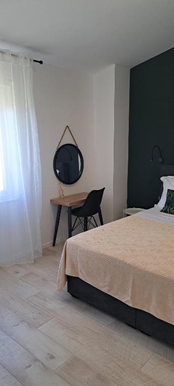Postel nebo postele na pokoji v ubytování Apartmani Darko