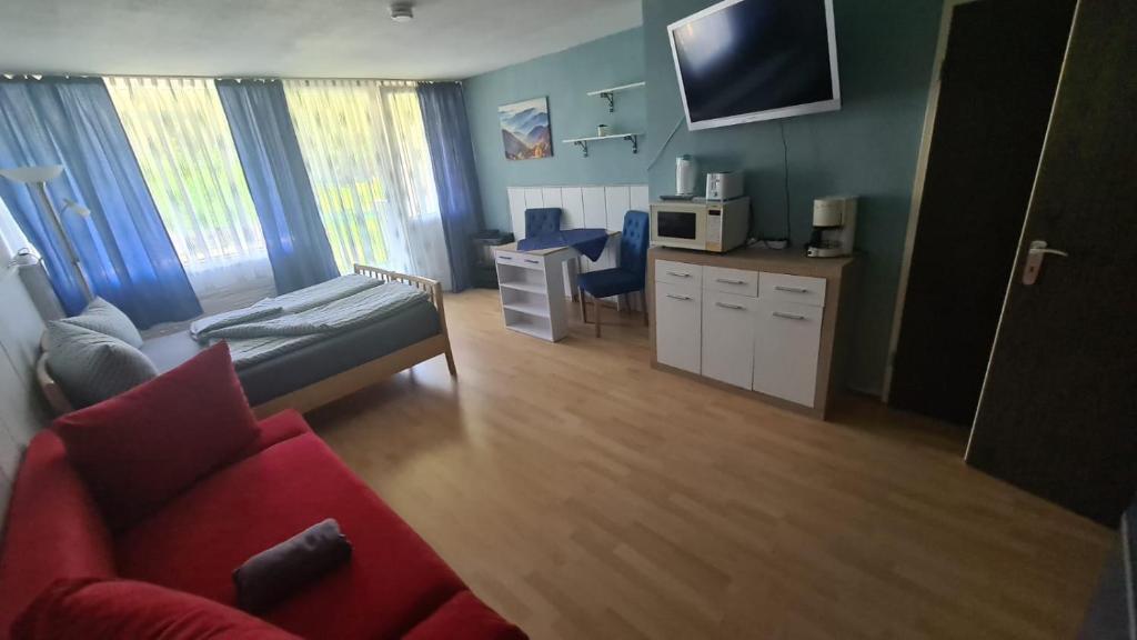 TV a/nebo společenská místnost v ubytování Traumurlaub im Bayerische Wald