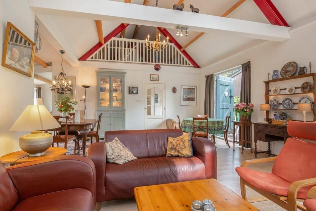 Posezení v ubytování Hello Zeeland - Vakantiehuis Het Blauwe Hof