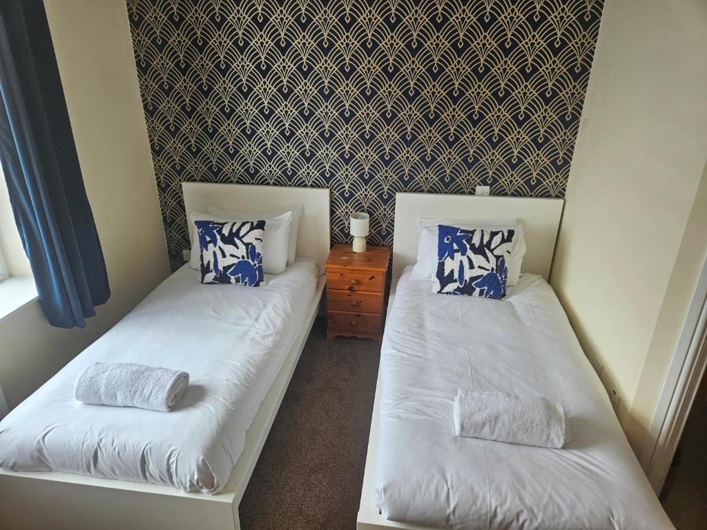 Postel nebo postele na pokoji v ubytování FoxandMaple