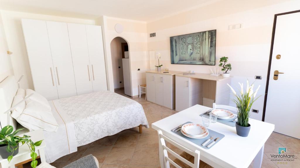 Postel nebo postele na pokoji v ubytování Apartments & Suites Vento Mare