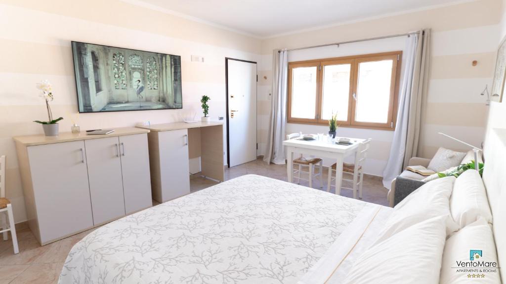 Postel nebo postele na pokoji v ubytování Apartments & Suites Vento Mare