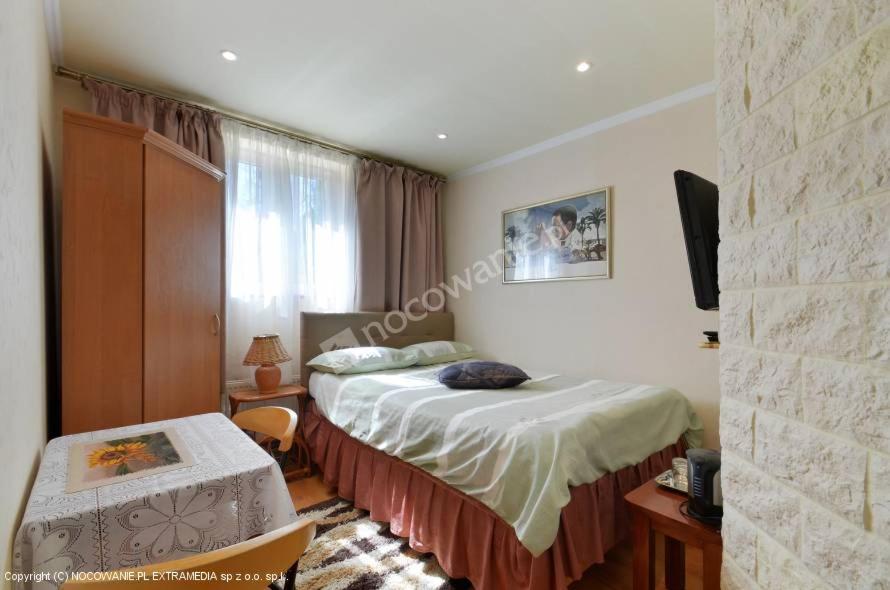 Posteľ alebo postele v izbe v ubytovaní Casablanca Pokoje i Apartamenty