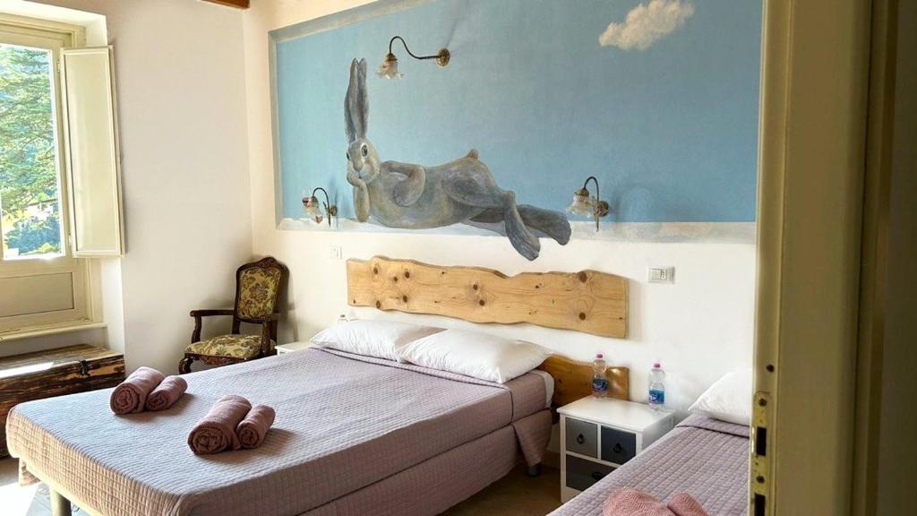 Postel nebo postele na pokoji v ubytování Hotel Baldo