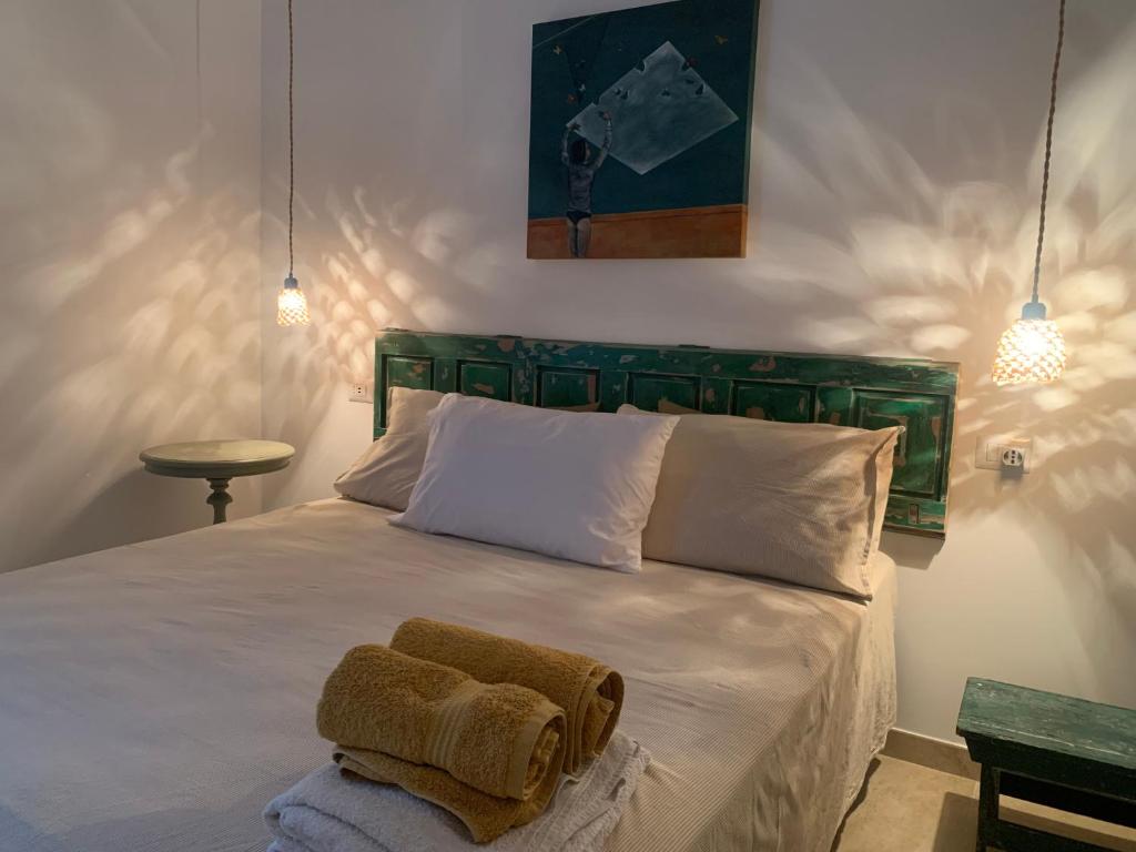 Ένα ή περισσότερα κρεβάτια σε δωμάτιο στο Casale Montedoro