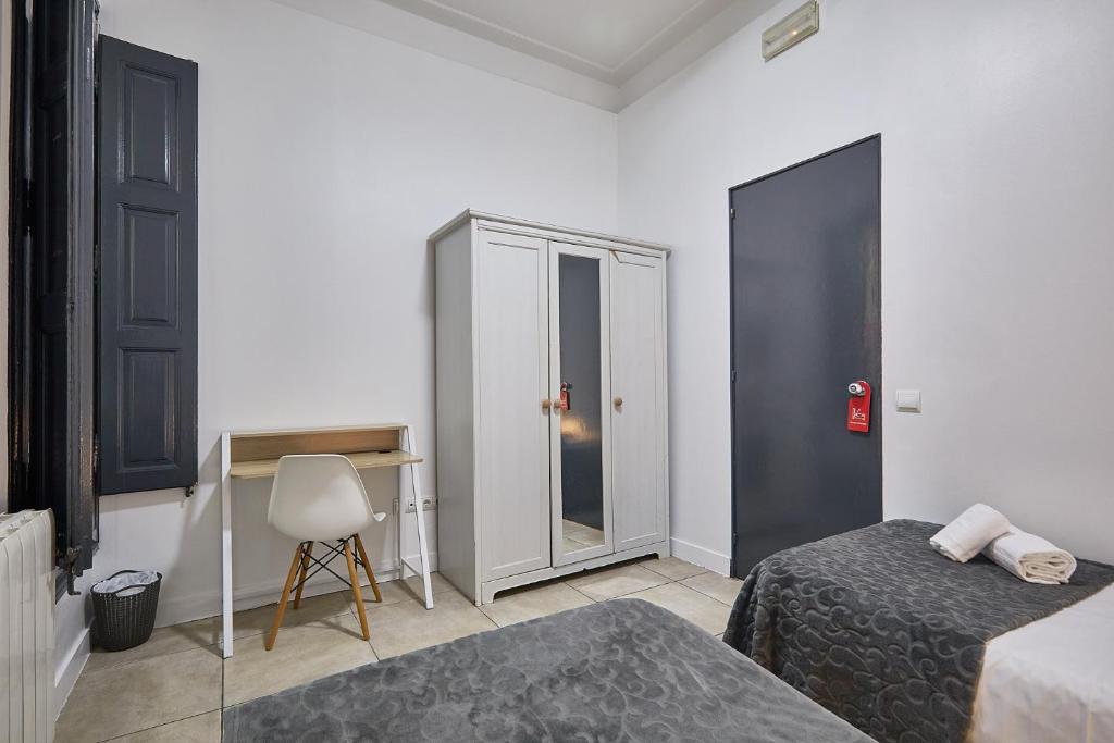 Posteľ alebo postele v izbe v ubytovaní Ella Hostel Gran Vía