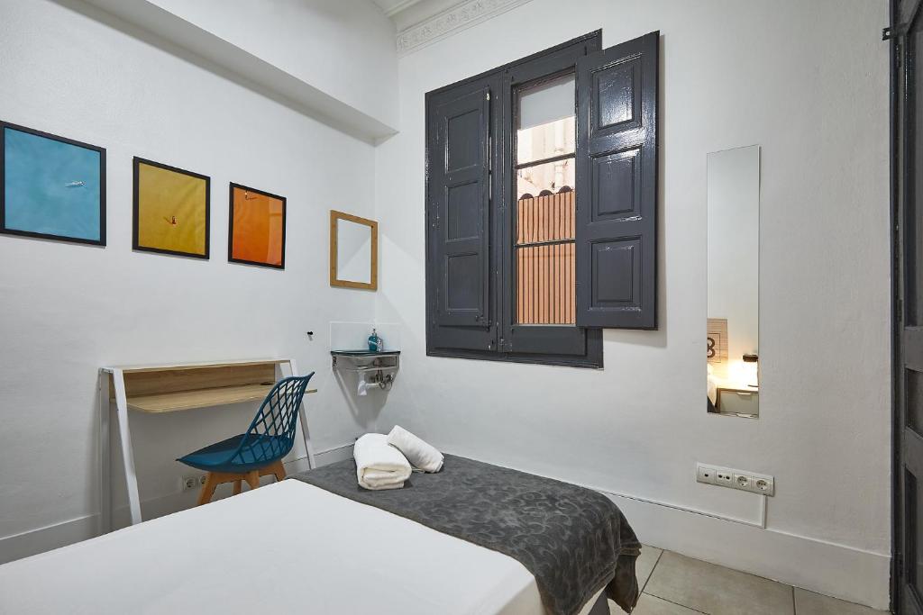 Posteľ alebo postele v izbe v ubytovaní Ella Hostel Gran Vía