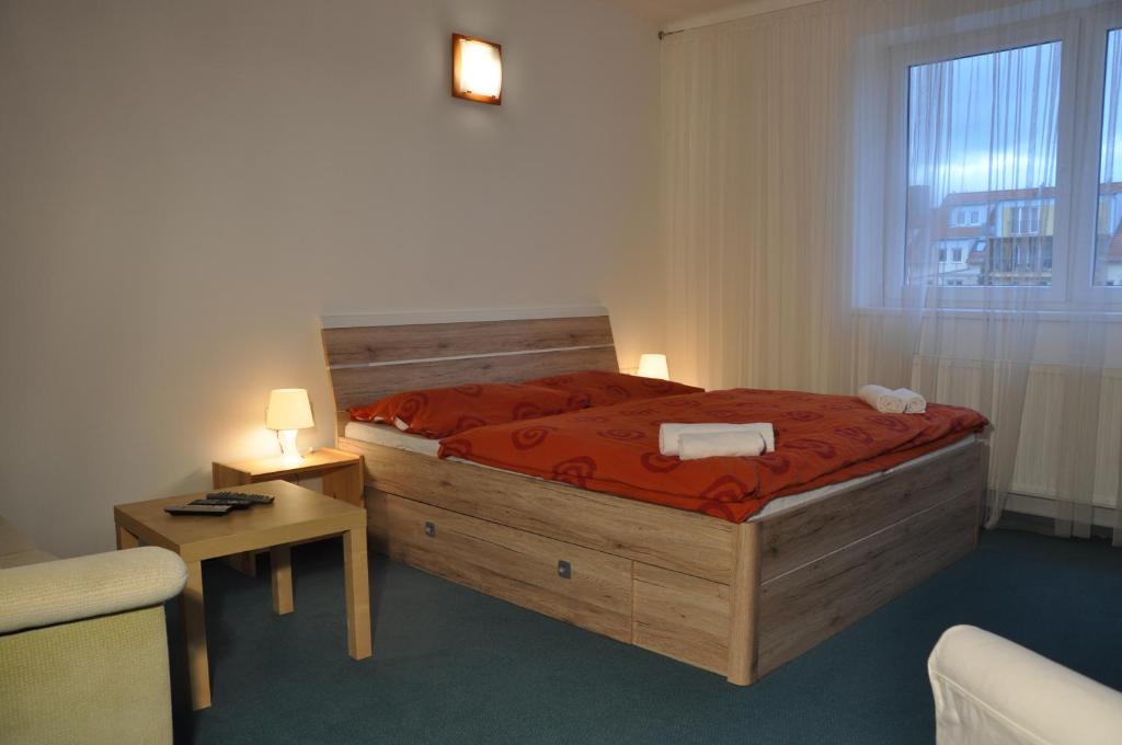 Postel nebo postele na pokoji v ubytování Penzion U Vlka