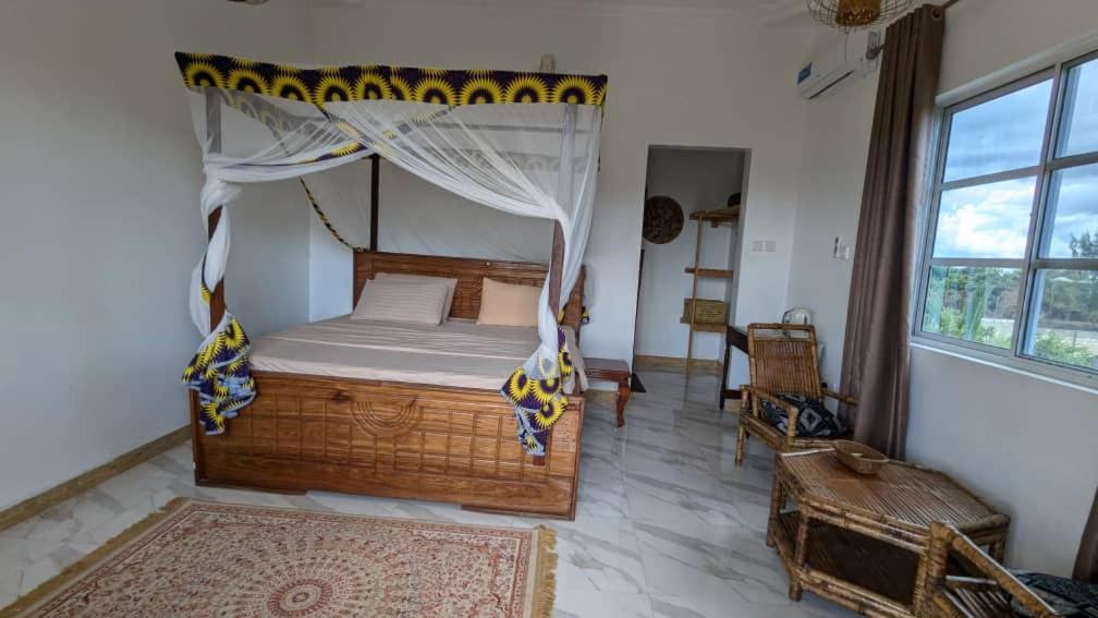 Postel nebo postele na pokoji v ubytování Palm Heaven Villa