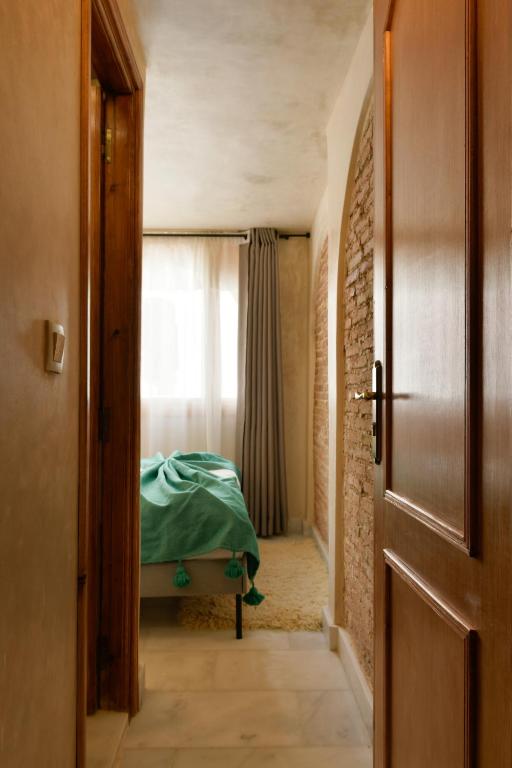 Postel nebo postele na pokoji v ubytování La Casita Guennoun Kasbah