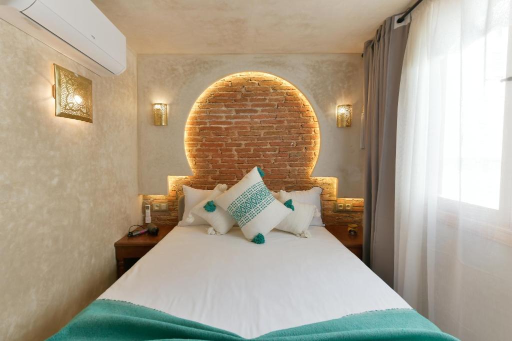 Postel nebo postele na pokoji v ubytování La Casita Guennoun Kasbah