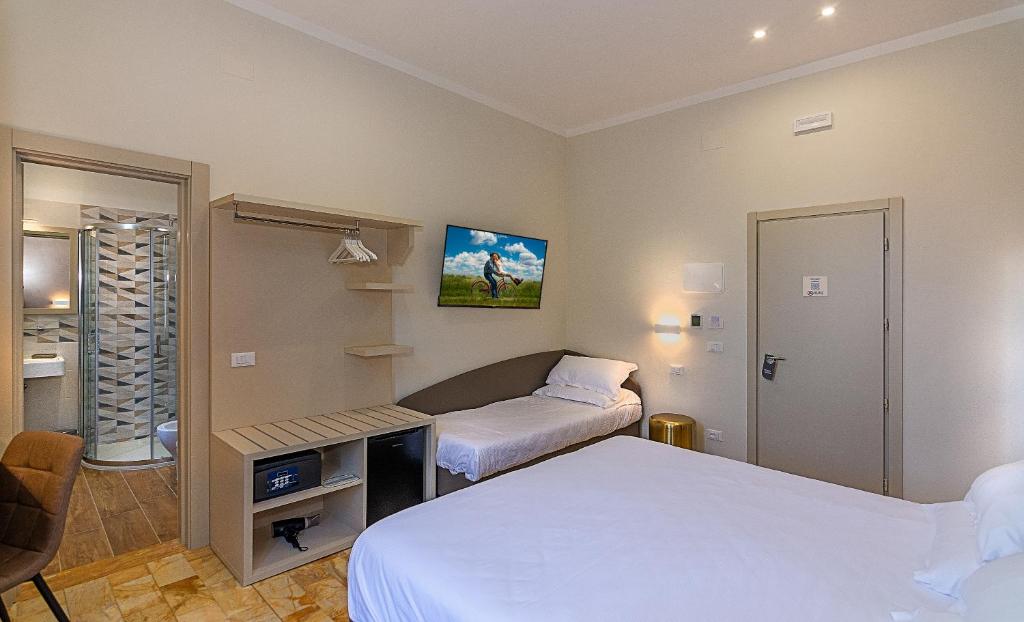 Postel nebo postele na pokoji v ubytování Hotel Eura