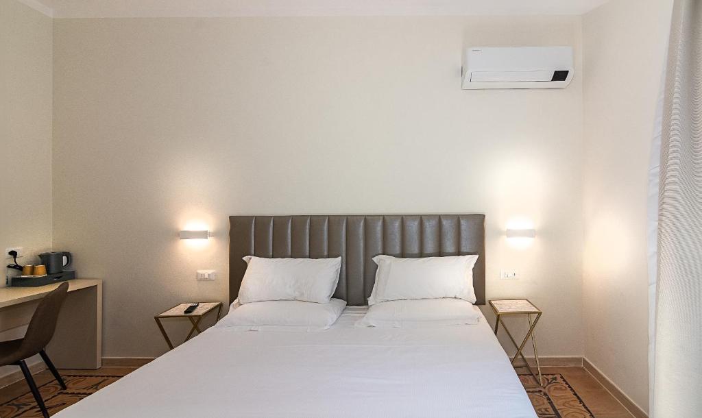 Postel nebo postele na pokoji v ubytování Hotel Eura