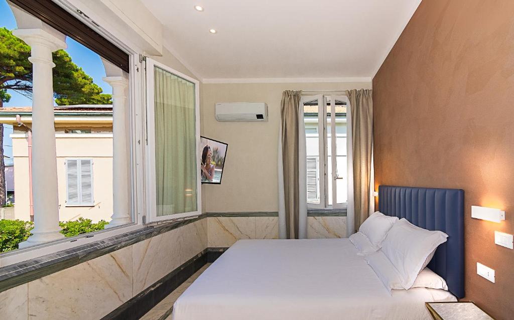 Postel nebo postele na pokoji v ubytování Hotel Eura