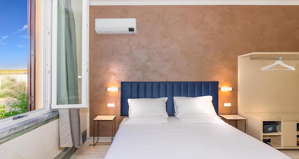 Postel nebo postele na pokoji v ubytování Hotel Eura