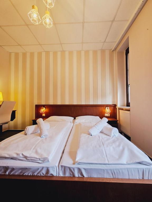 Postel nebo postele na pokoji v ubytování IKURA Hotel Self-check-in