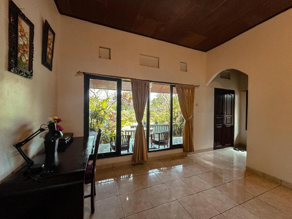 Posezení v ubytování Kampoeng Joglo Abangan Ubud