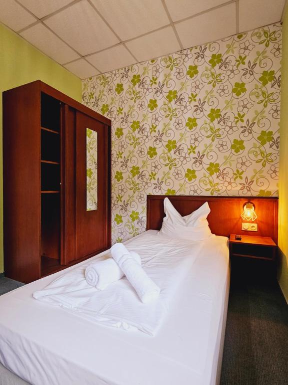 Postel nebo postele na pokoji v ubytování IKURA Hotel Self-check-in