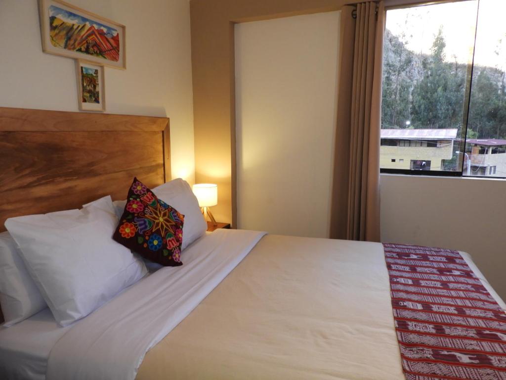 Postel nebo postele na pokoji v ubytování Ayllu B&B Ollantaytambo