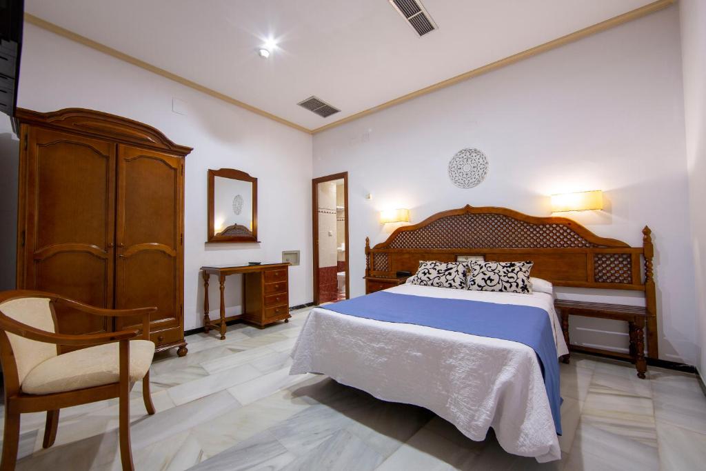 Postel nebo postele na pokoji v ubytování Hotel Los Omeyas