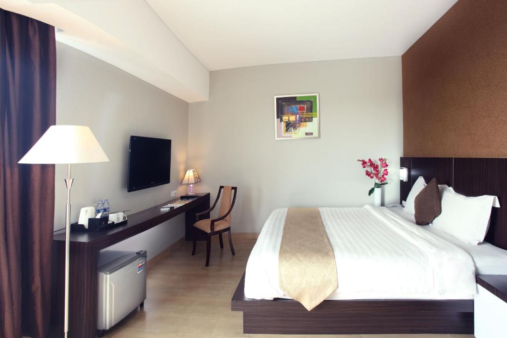 Postel nebo postele na pokoji v ubytování Grand Hatika Hotel
