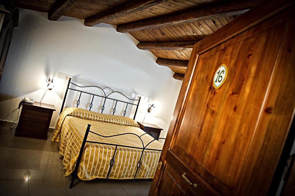 Postel nebo postele na pokoji v ubytování Hotel Aliai