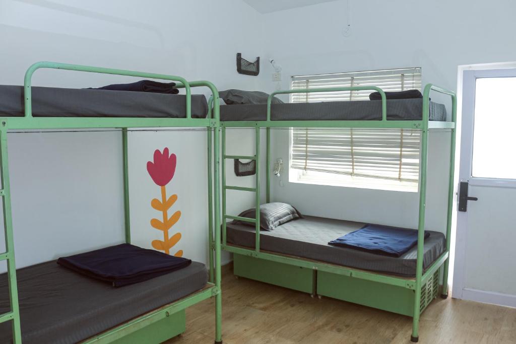 Postel nebo postele na pokoji v ubytování Summer Hostel