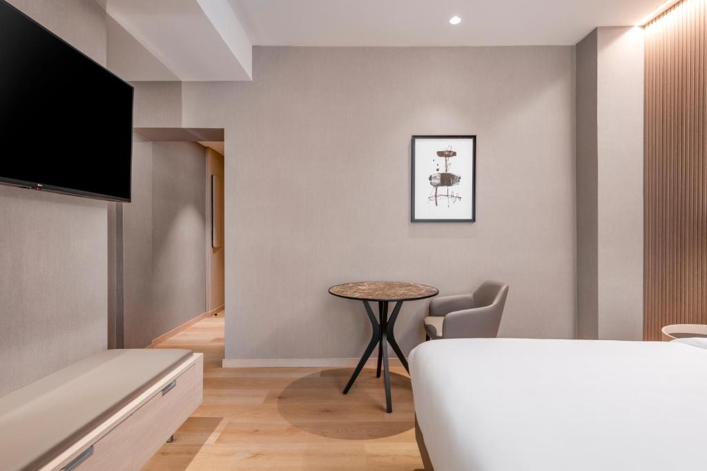 Postel nebo postele na pokoji v ubytování AC Hotel by Marriott Clodio Roma