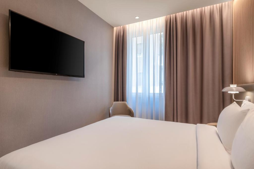 TV a/nebo společenská místnost v ubytování AC Hotel by Marriott Clodio Roma