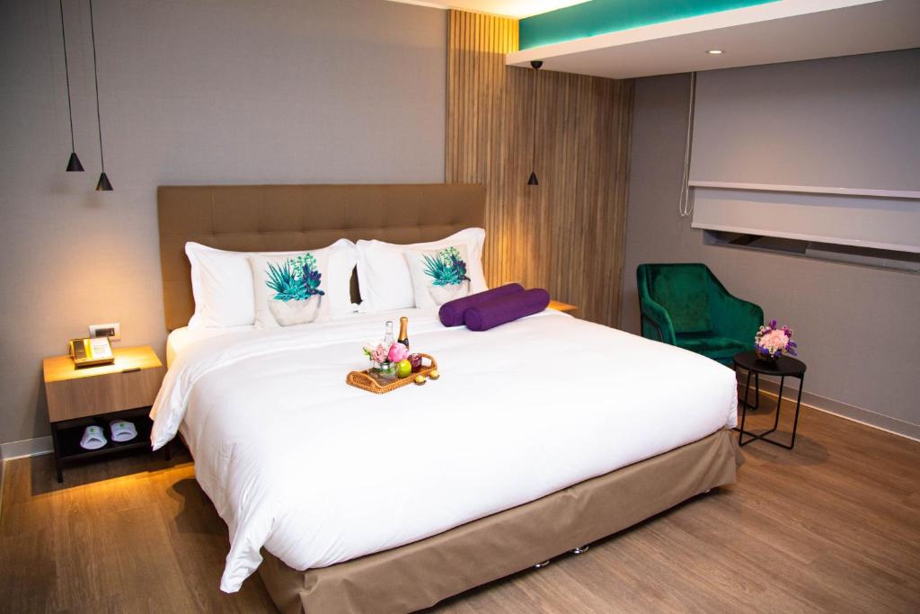 Postel nebo postele na pokoji v ubytování Palmetto Hotel Business San Borja