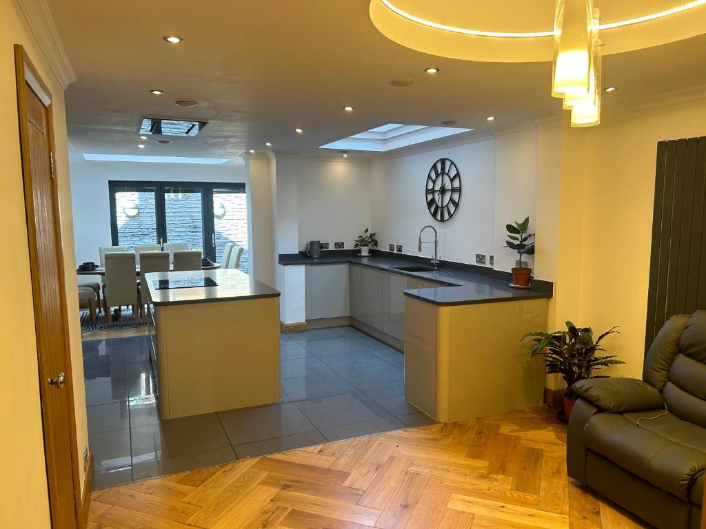 a kitchen with a sink and a counter at Entire Seaside Home 6 Private BedRooms Sleeps 10,4 Minute Walk To Station in New Brighton