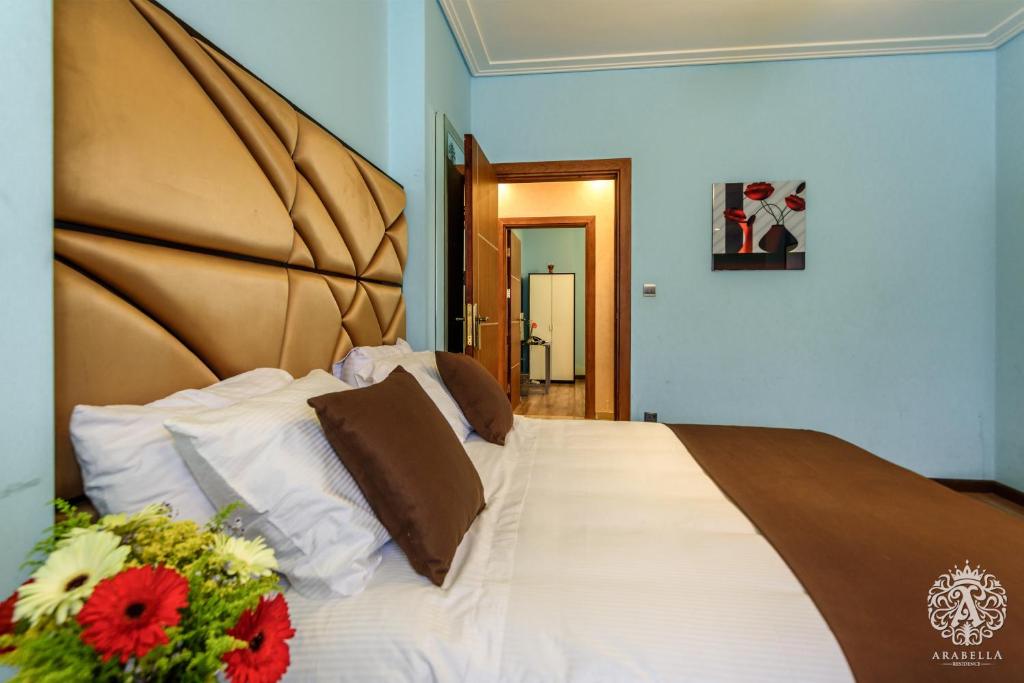 Postel nebo postele na pokoji v ubytování Arabella Residence