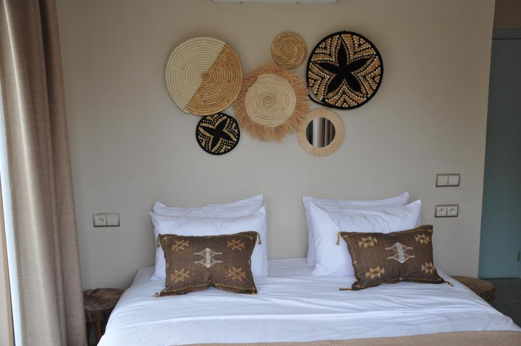 Postel nebo postele na pokoji v ubytování harmony surf lodge
