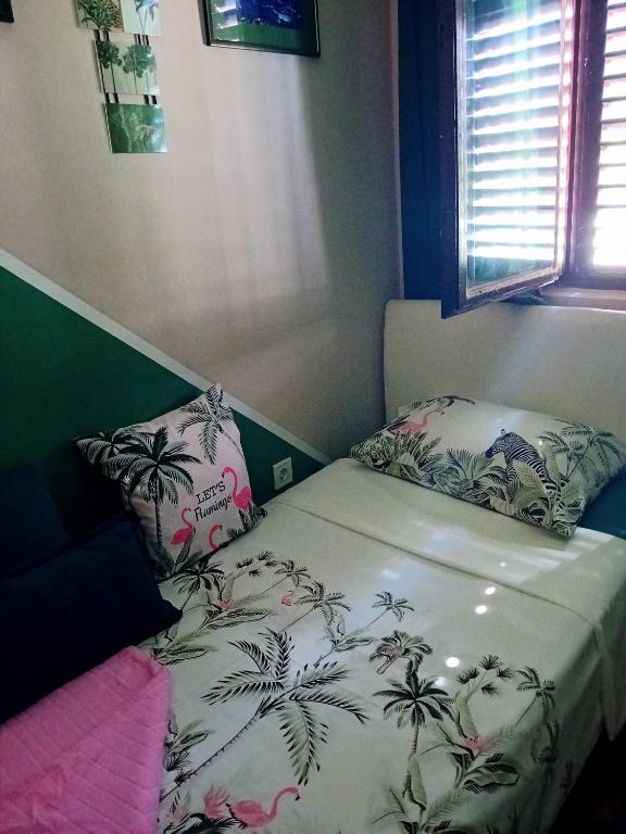 Llit o llits en una habitació de Guest House Cinderella