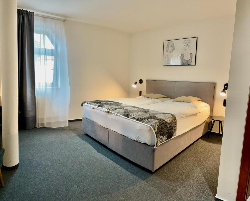 Postel nebo postele na pokoji v ubytování Rozmaryn Rooms & Apartments