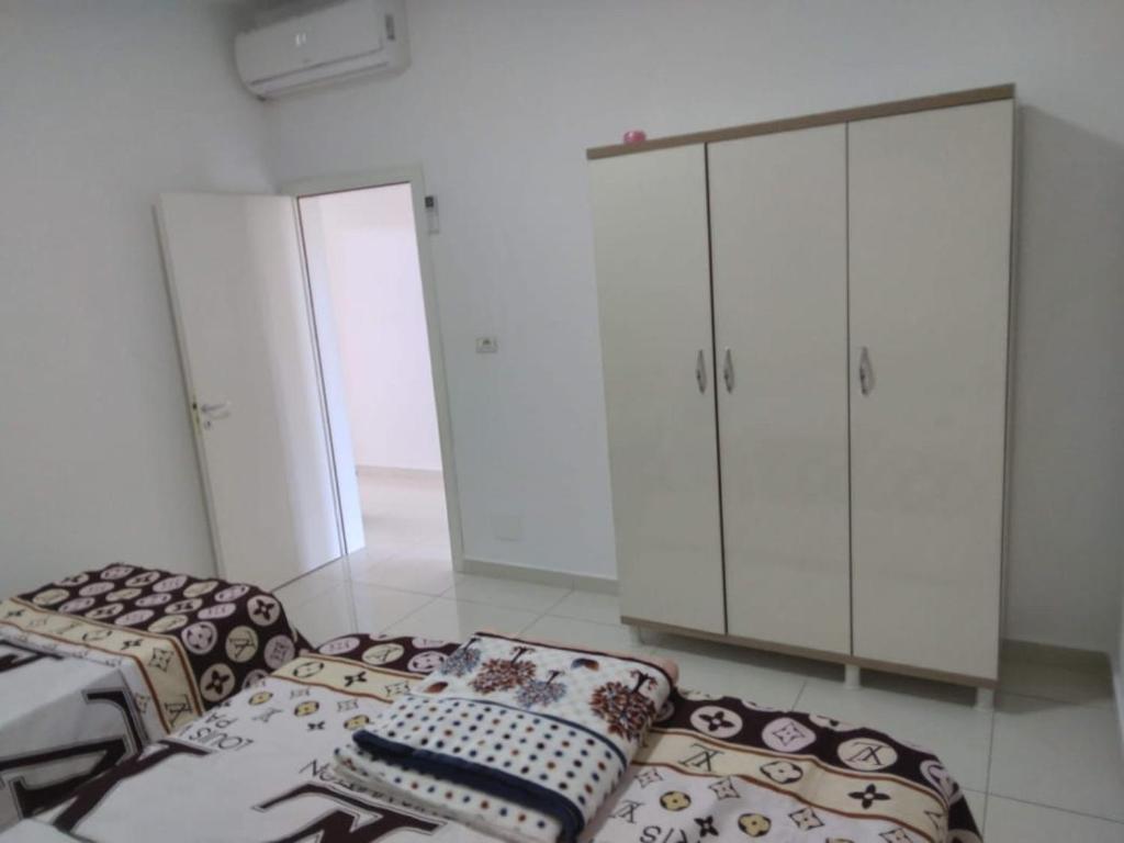 Postelja oz. postelje v sobi nastanitve Flat Ergli