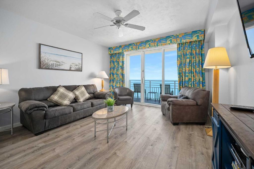 a living room with a couch and a table at Luxury 17th Floor 1 BR Condo Direct Oceanfront Wyndham Ocean Walk Resort Daytona Beach | 1708 in Daytona Beach