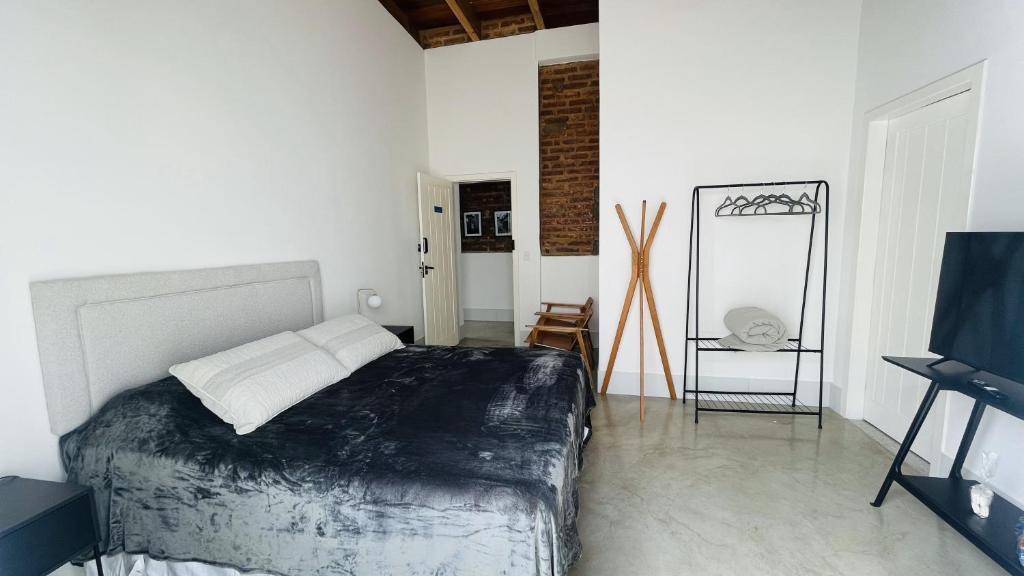 Postel nebo postele na pokoji v ubytování Vila Casarão - Casa de Hóspedes