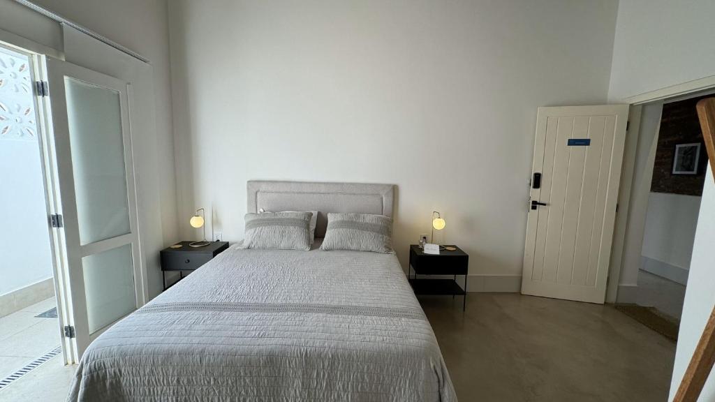 Postel nebo postele na pokoji v ubytování Vila Casarão - Casa de Hóspedes