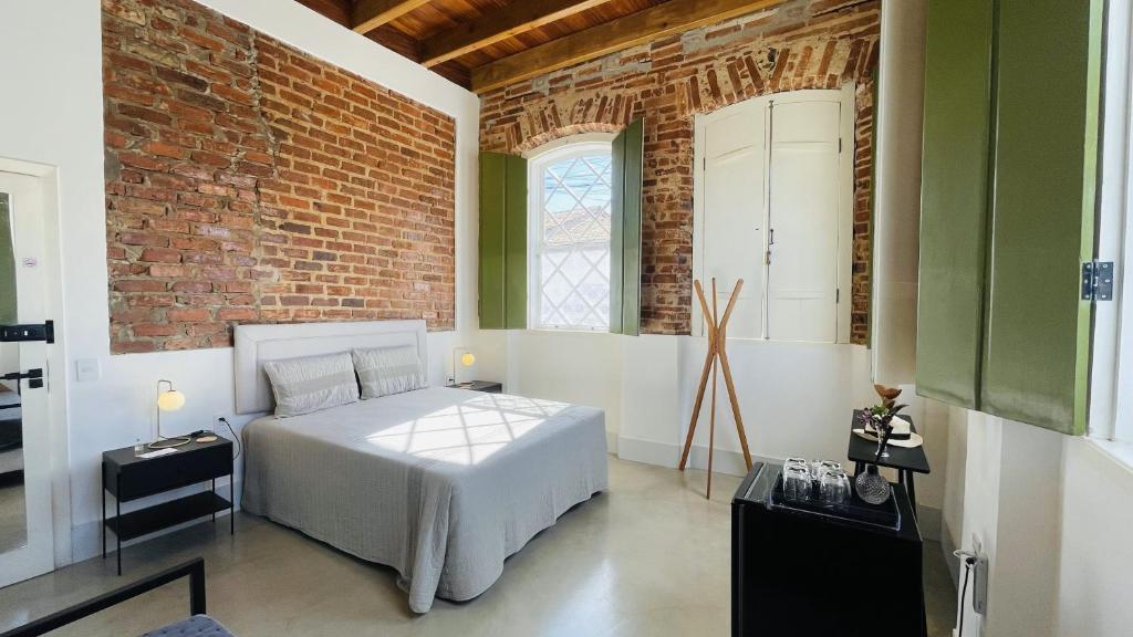 Postel nebo postele na pokoji v ubytování Vila Casarão - Casa de Hóspedes