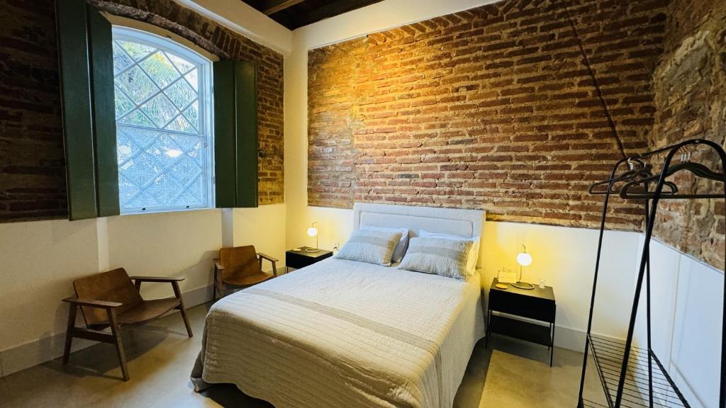 Postel nebo postele na pokoji v ubytování Vila Casarão - Casa de Hóspedes