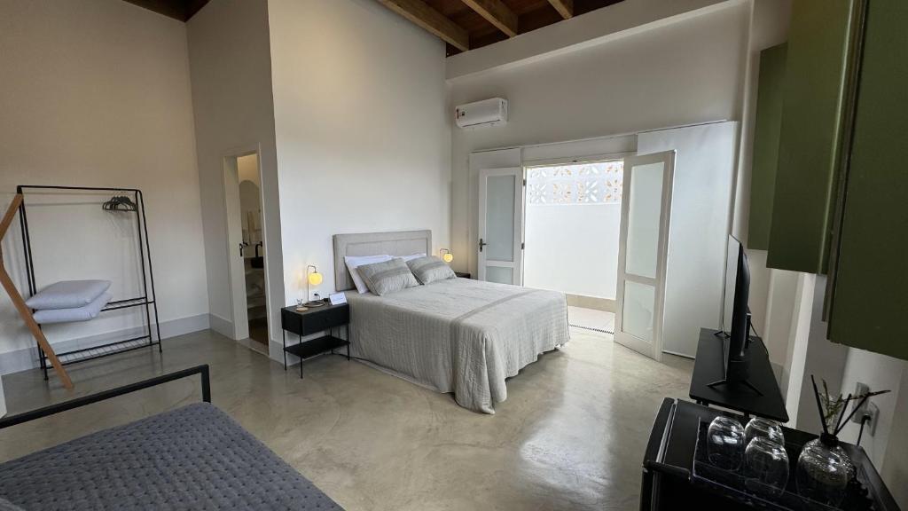 Postel nebo postele na pokoji v ubytování Vila Casarão - Casa de Hóspedes