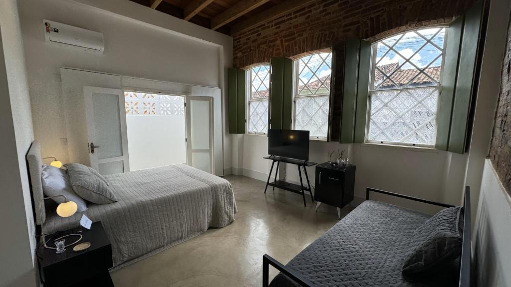 Postel nebo postele na pokoji v ubytování Vila Casarão - Casa de Hóspedes