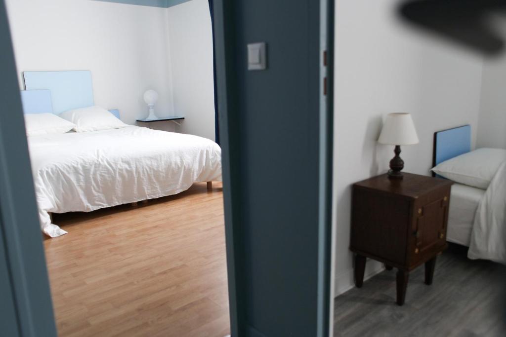 Postel nebo postele na pokoji v ubytování La Part Entière