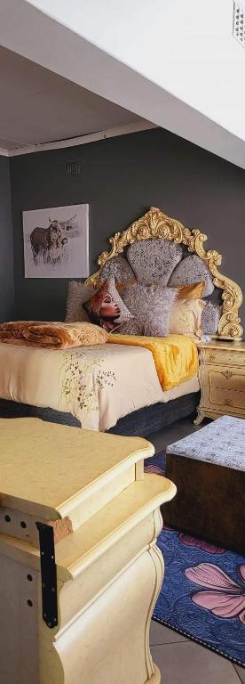a bedroom with two beds and a mirror on the wall at Goodlife guest house in klerksdorp in Klerksdorp