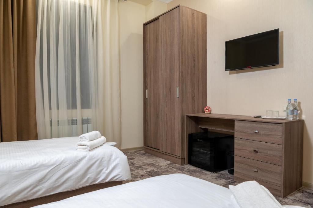 Postel nebo postele na pokoji v ubytování Aeka-hotel