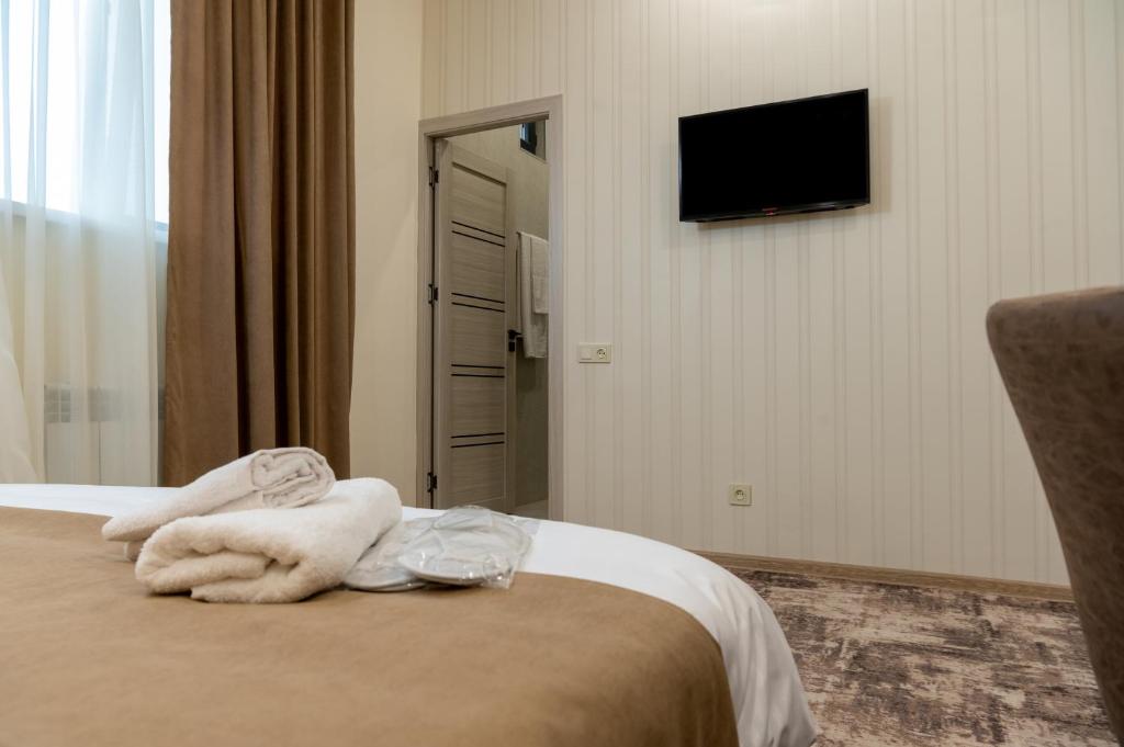 Postel nebo postele na pokoji v ubytování Aeka-hotel